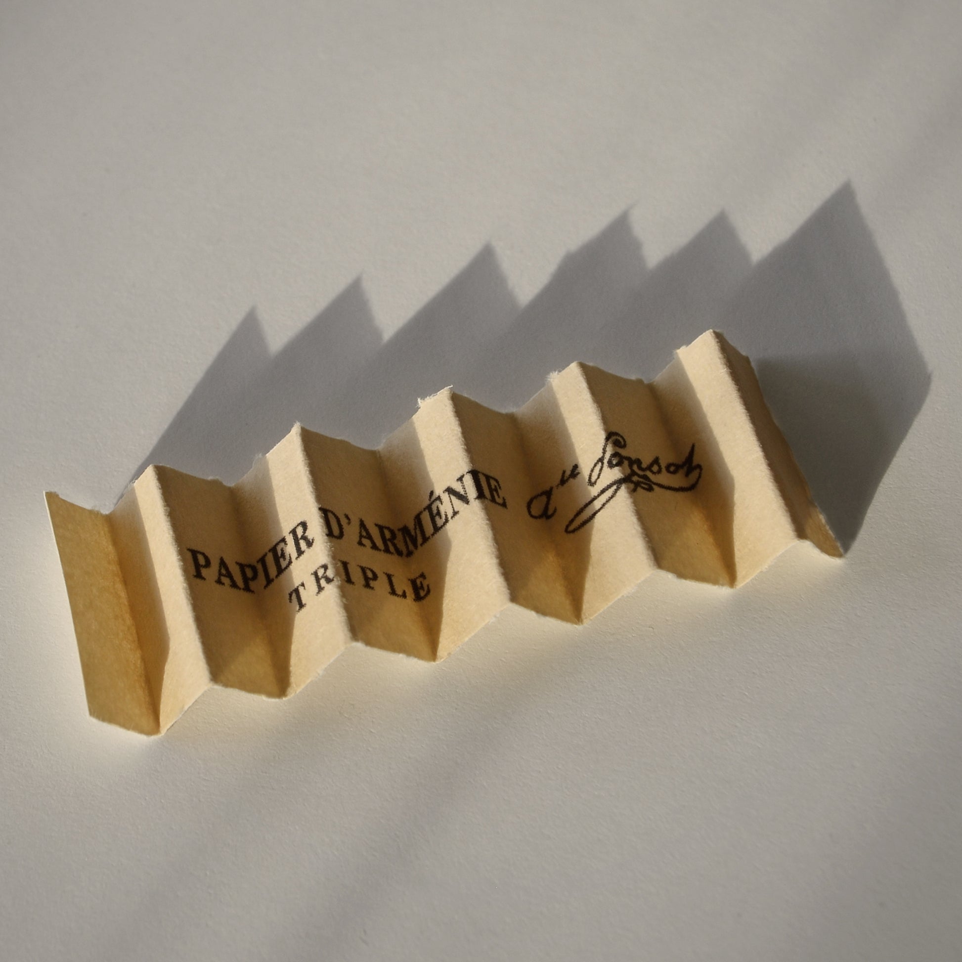 An single piece of accordion folded Papier d'Armenie incense paper.