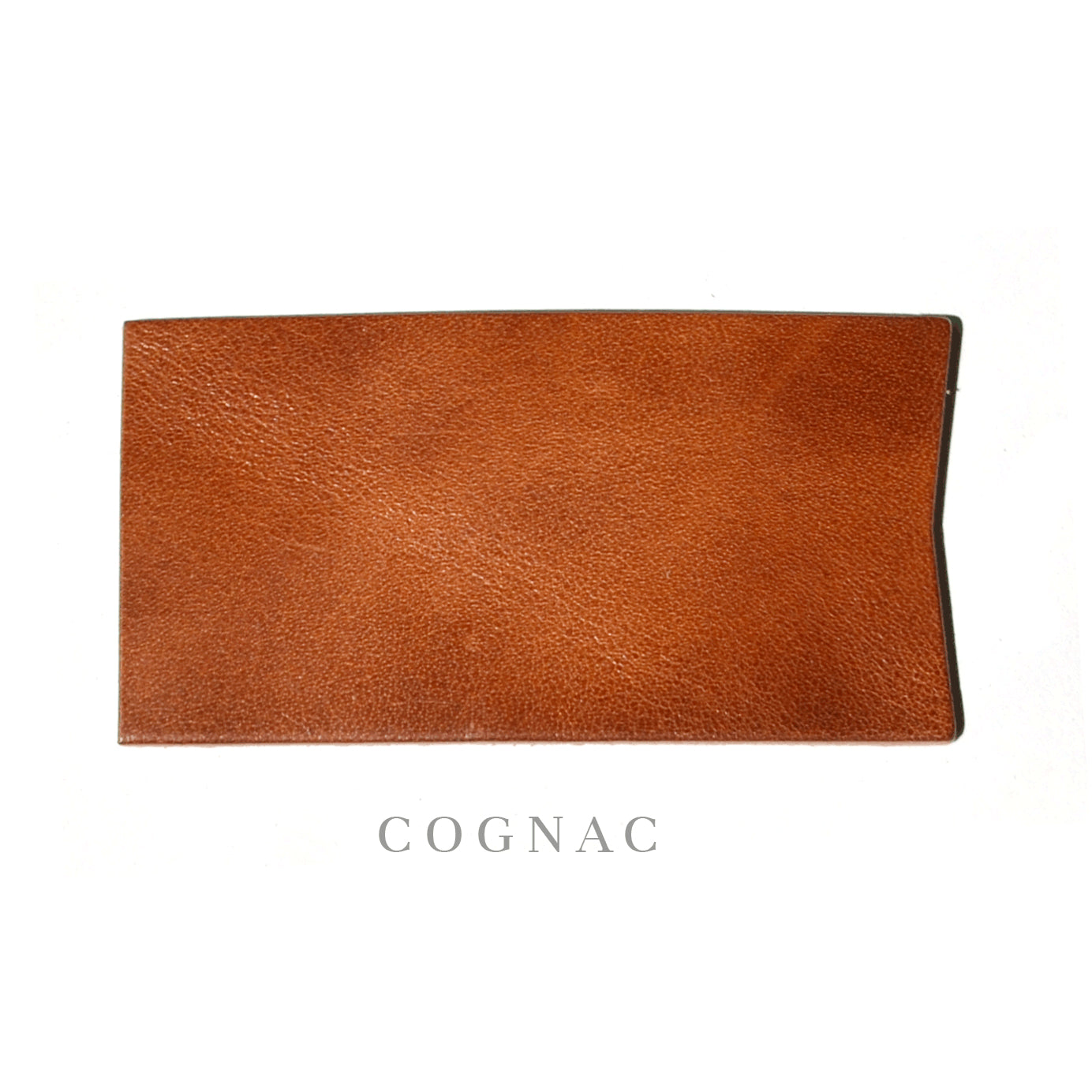 A rectangular-like swatch of cognac color leather. 